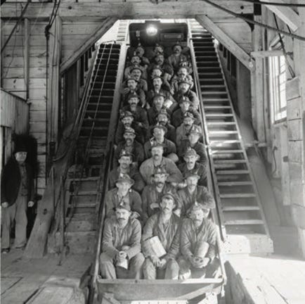 Men in copper mining carts