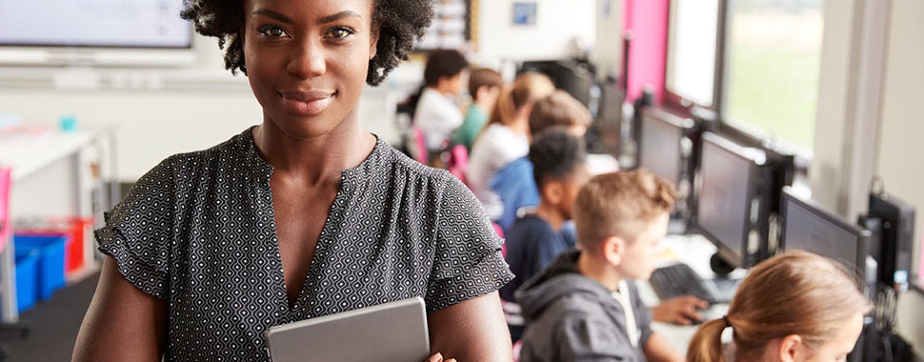 African American Teacher standing in front of students